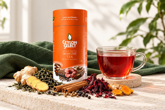 Orange Ceylon Select Immune Tea canister with a ruby-coloured cup and ginger, cinnamon, hibiscus and turmeric.